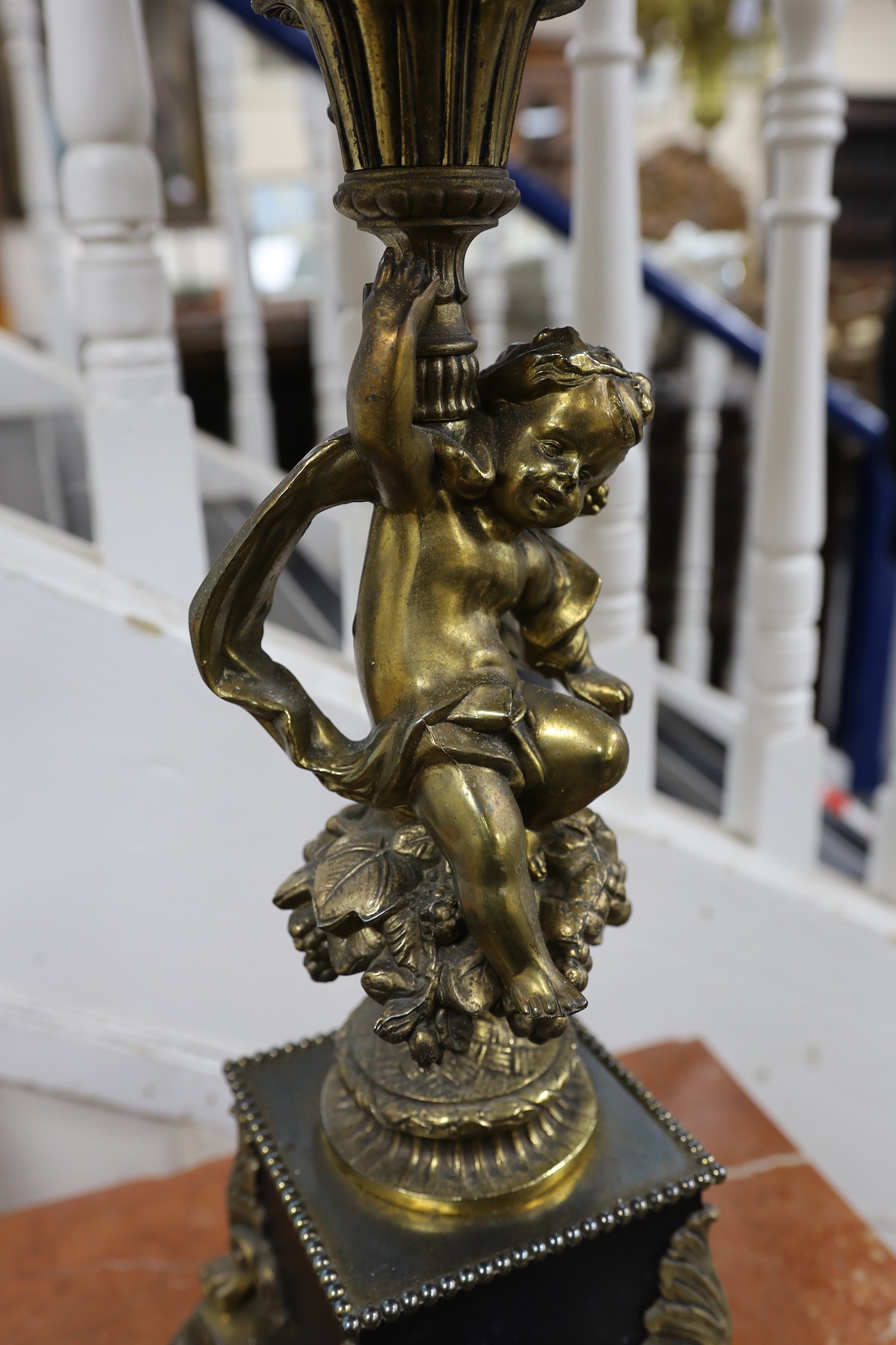 A large cherub stem cast brass five light table lamp with shade, 99cms high including shade